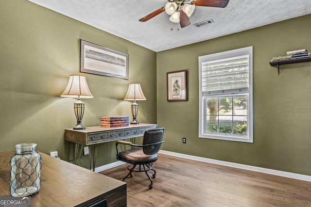 108 Wortham Dr, Buckhead, GA 30625 - home office featuring ceiling fan, wood finished floors, baseboards, and a textured ceiling