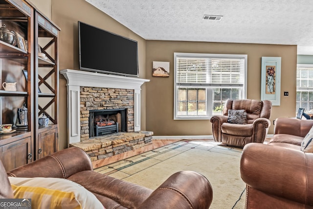 108 Wortham Dr, Buckhead, GA 30625 - living area with a textured ceiling, a fireplace, and baseboards