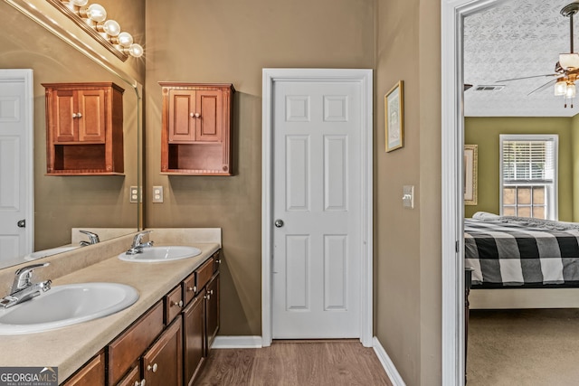 108 Wortham Dr, Buckhead, GA 30625 - bathroom featuring baseboards, a ceiling fan, wood finished floors, and connected bathroom