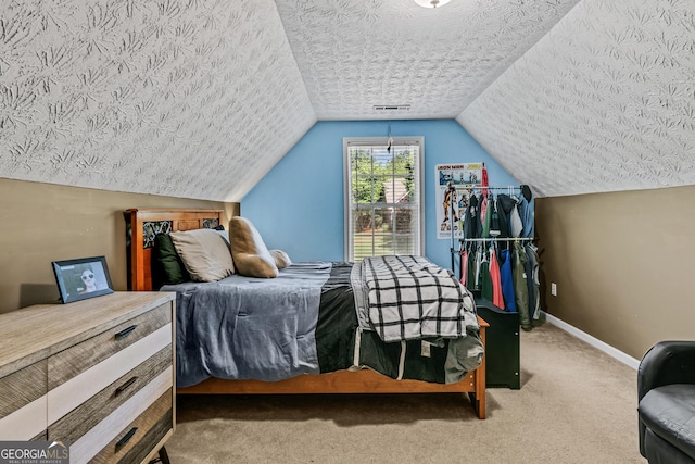 108 Wortham Dr, Buckhead, GA 30625 - carpeted bedroom with baseboards, vaulted ceiling, and a textured ceiling