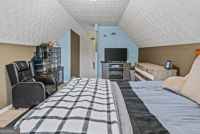108 Wortham Dr, Buckhead, GA 30625 - bedroom featuring baseboards, vaulted ceiling, and a textured ceiling