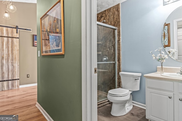 108 Wortham Dr, Buckhead, GA 30625 - bathroom featuring a shower stall, baseboards, wood finished floors, and toilet