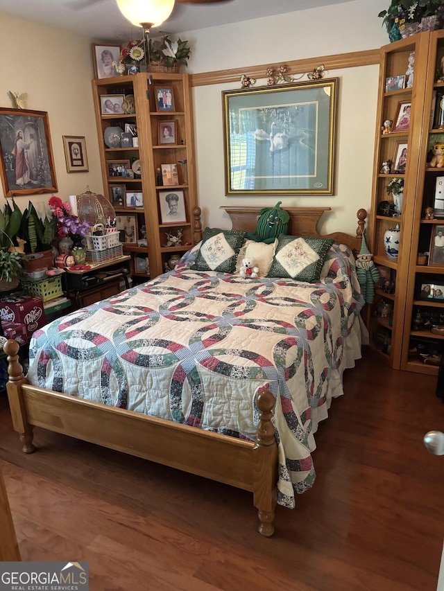 bedroom featuring wood finished floors