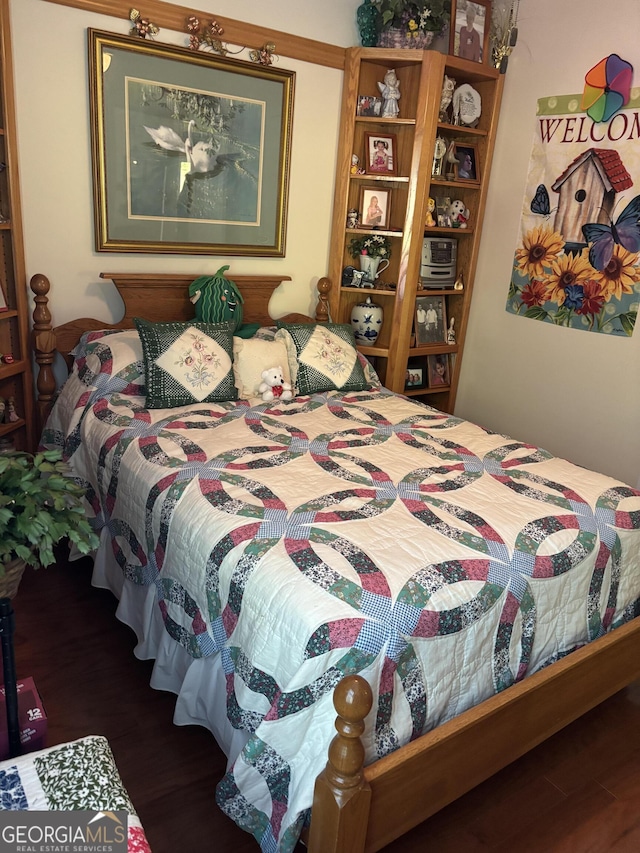 bedroom with wood finished floors