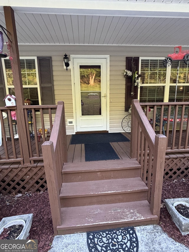 doorway to property with a porch