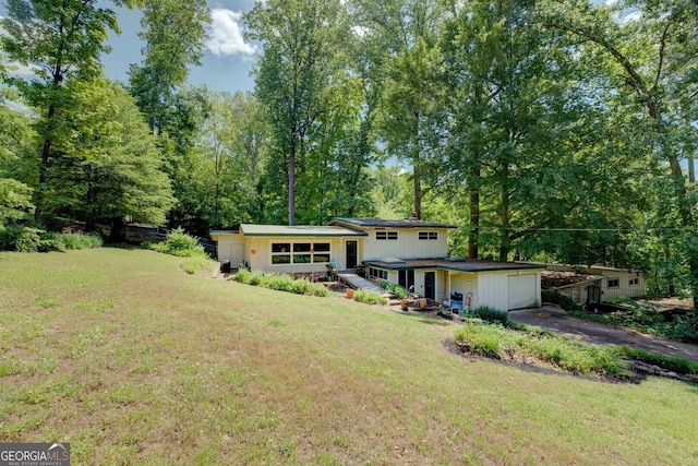 3449 Archwood Dr, Doraville, GA 30340 - view of front of home featuring an attached garage, asphalt driveway, and a front lawn