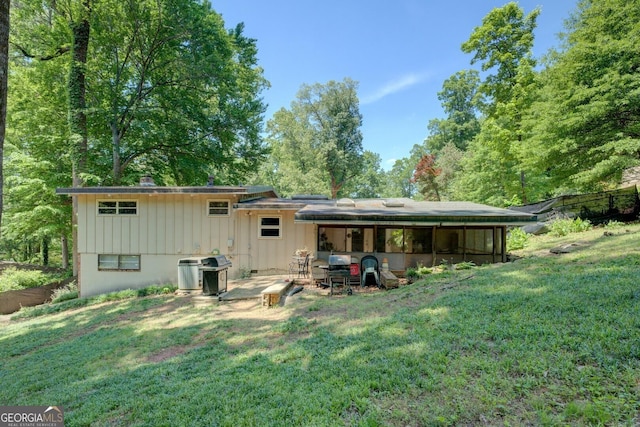 3449 Archwood Dr, Doraville, GA 30340 - rear view of property with a yard, a patio area, and board and batten siding