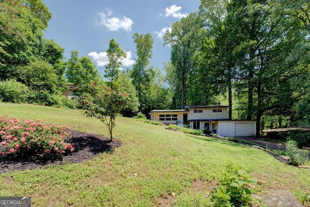 3449 Archwood Dr, Doraville, GA 30340 - view of green lawn featuring driveway and a garage
