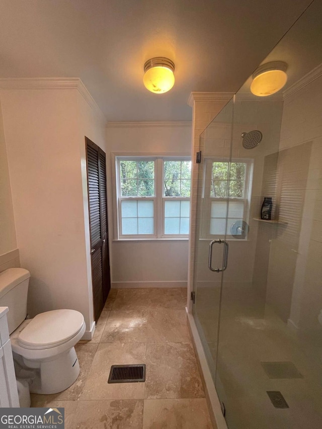 750 Warners Lndg, Hortense, GA 31543 - bathroom featuring ornamental molding, toilet, a stall shower, and baseboards