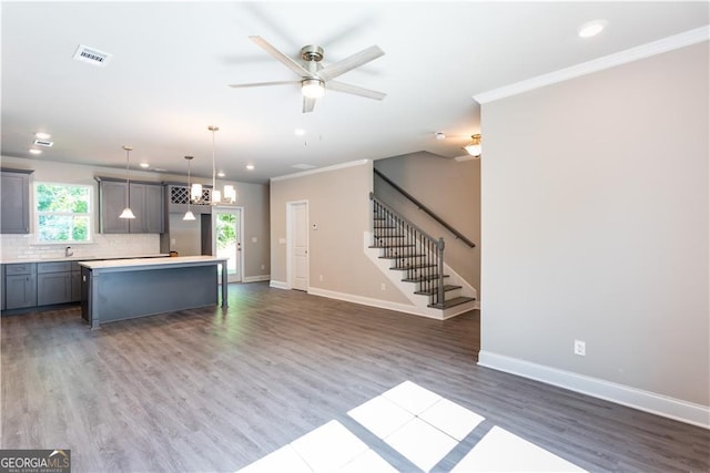 3352 Landings S Dr, Atlanta, GA 30331 - kitchen with ornamental molding, baseboards, gray cabinets, dark wood-style flooring, and tasteful backsplash