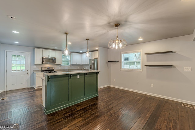 947 Rebel Forest Dr, Atlanta, GA 30315 - kitchen featuring stainless steel appliances, white cabinets, light countertops, baseboards, and recessed lighting