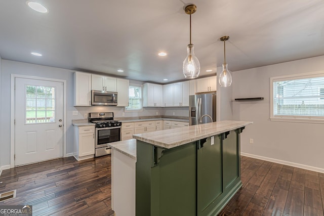 947 Rebel Forest Dr, Atlanta, GA 30315 - kitchen featuring appliances with stainless steel finishes, white cabinets, dark wood-style flooring, and recessed lighting