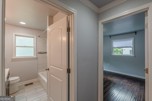 947 Rebel Forest Dr, Atlanta, GA 30315 - bathroom with toilet, wood finished floors, baseboards, ornamental molding, and vanity
