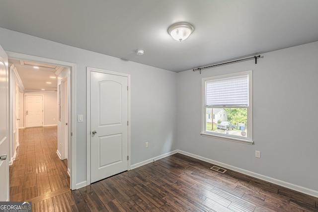 947 Rebel Forest Dr, Atlanta, GA 30315 - unfurnished bedroom featuring dark wood-style flooring and baseboards