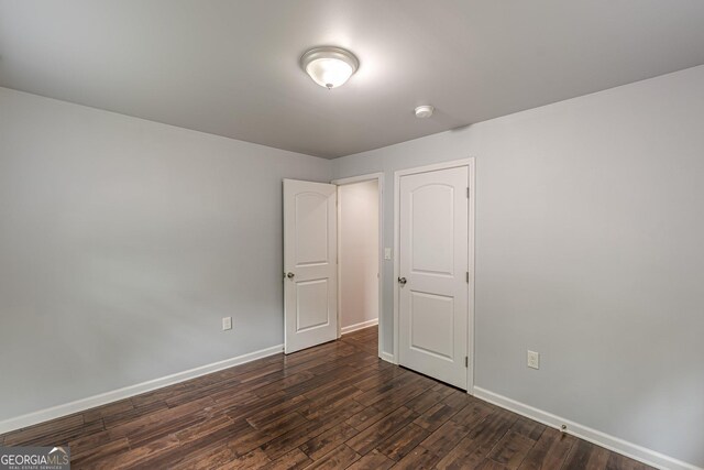 947 Rebel Forest Dr, Atlanta, GA 30315 - unfurnished bedroom featuring dark wood-type flooring and baseboards
