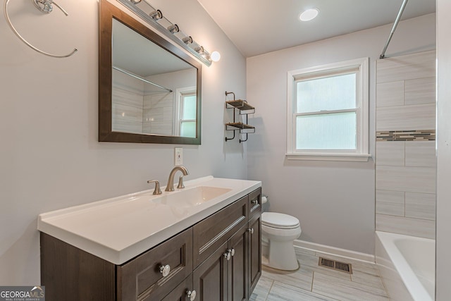 947 Rebel Forest Dr, Atlanta, GA 30315 - bathroom with toilet, baseboards, vanity, and shower / washtub combination