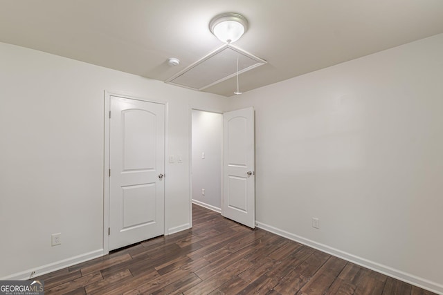 947 Rebel Forest Dr, Atlanta, GA 30315 - unfurnished bedroom with attic access, dark wood-style flooring, and baseboards