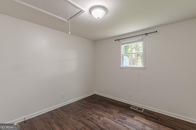 947 Rebel Forest Dr, Atlanta, GA 30315 - unfurnished room with attic access, dark wood-style flooring, and baseboards