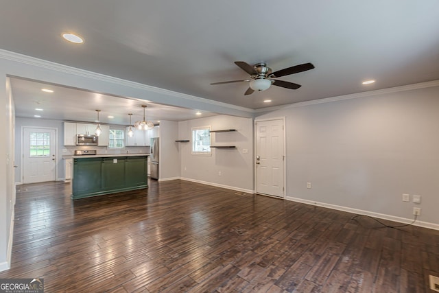 947 Rebel Forest Dr, Atlanta, GA 30315 - unfurnished living room featuring a ceiling fan, dark wood finished floors, baseboards, recessed lighting, and crown molding