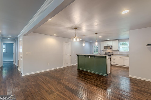 947 Rebel Forest Dr, Atlanta, GA 30315 - kitchen featuring appliances with stainless steel finishes, green cabinets, white cabinetry, recessed lighting, and an island with sink