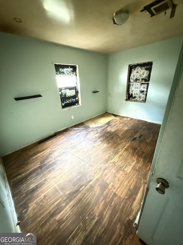 unfurnished bedroom featuring wood finished floors