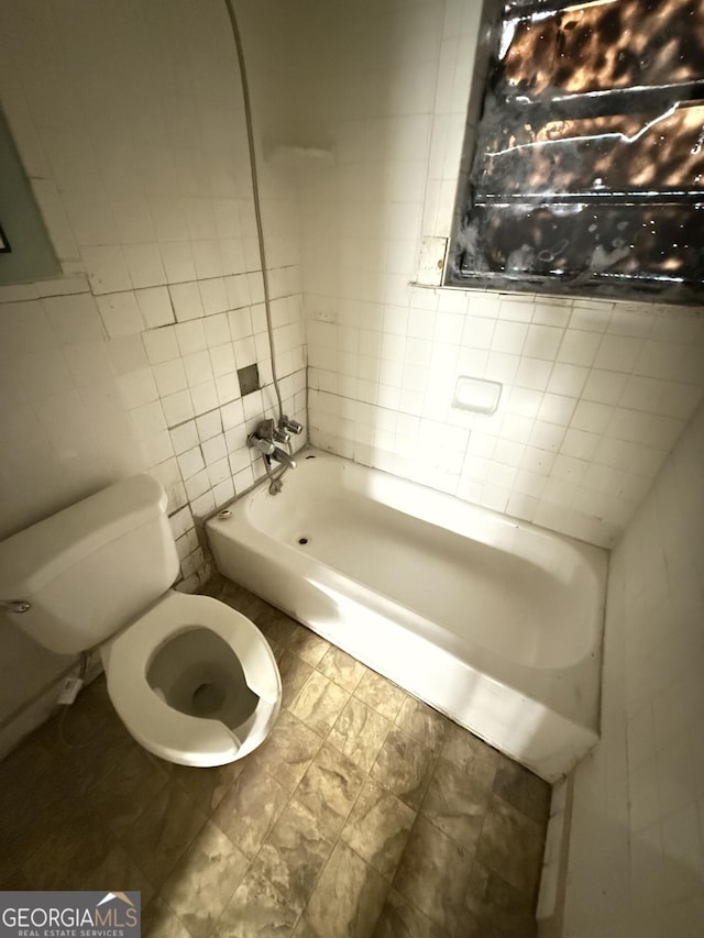 full bathroom with tile walls, a tub to relax in, toilet, and a shower