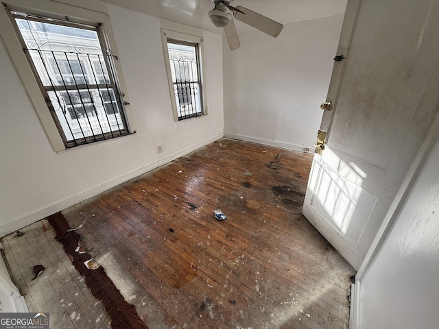 unfurnished bedroom with wood-type flooring and baseboards