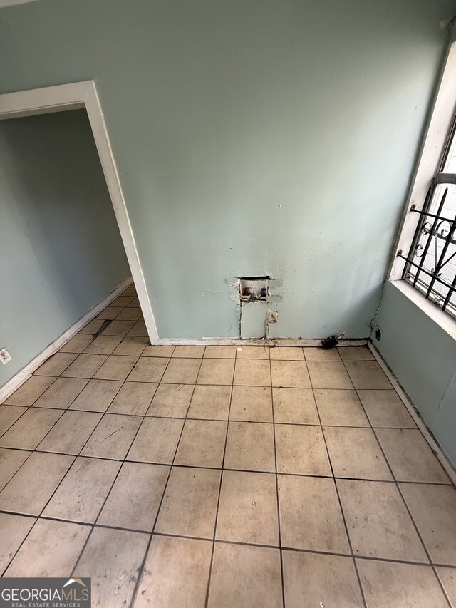 washroom with tile patterned floors