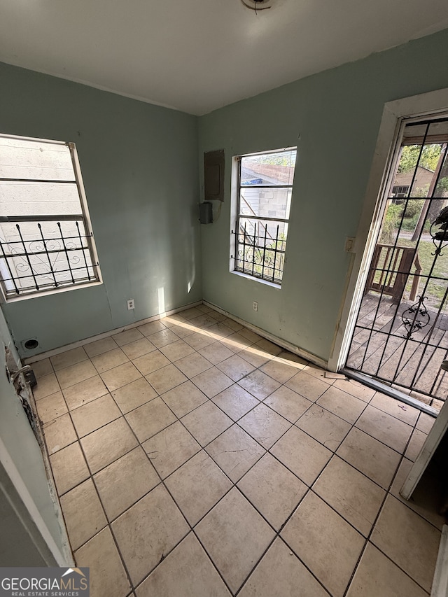 spare room featuring tile patterned flooring