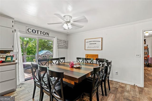 dining room featuring a ceiling fan, light wood-style flooring, ornamental molding, and baseboards