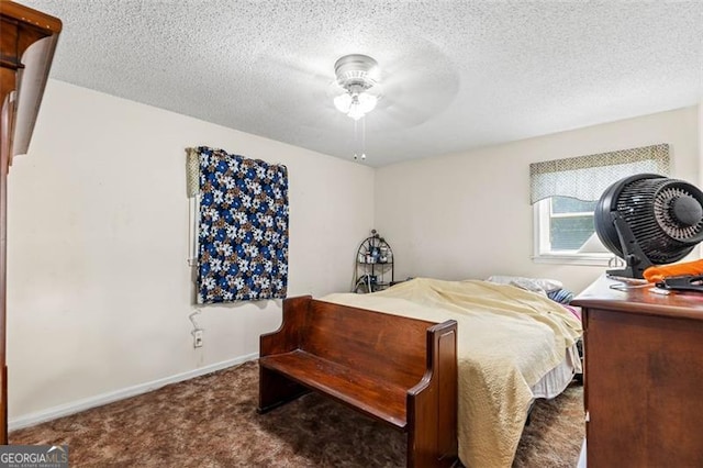 carpeted bedroom featuring baseboards, a textured ceiling, and ceiling fan