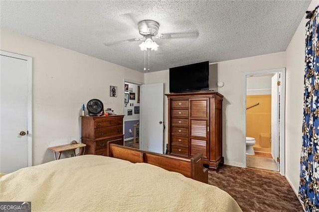 bedroom with carpet floors, a textured ceiling, connected bathroom, and a ceiling fan