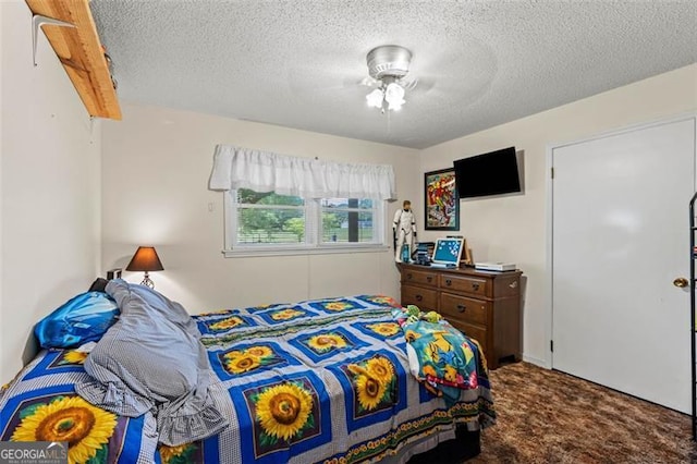 bedroom featuring carpet and a textured ceiling