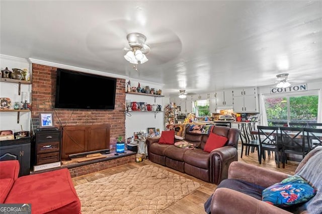 living room with ceiling fan and wood finished floors