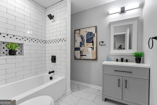 985 Columbia Dr, Decatur, GA 30030 - bathroom with marble finish floors, baseboards, shower / washtub combination, vanity, and toilet