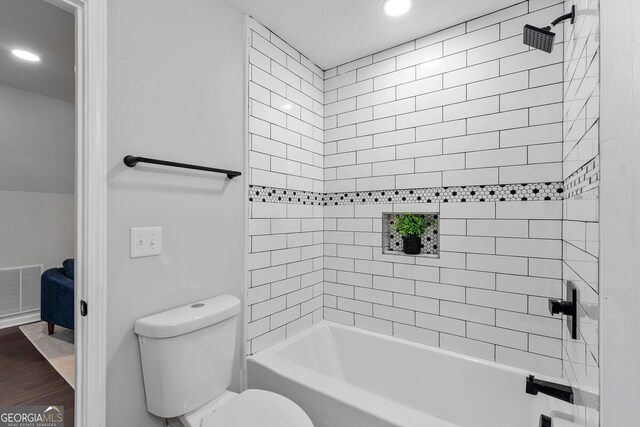 985 Columbia Dr, Decatur, GA 30030 - full bathroom featuring toilet, wood finished floors, recessed lighting, and washtub / shower combination