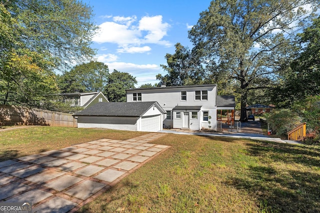 985 Columbia Dr, Decatur, GA 30030 - rear view of house featuring an attached garage, concrete driveway, and an outdoor structure