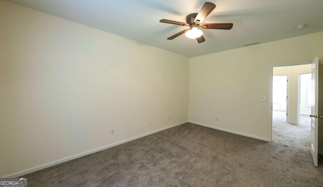 416 Clarion Dr, Carrollton, GA 30116 - carpeted empty room with a ceiling fan, baseboards, and a smoke detector