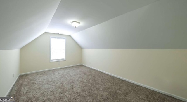 416 Clarion Dr, Carrollton, GA 30116 - additional living space with lofted ceiling, carpet flooring, and baseboards