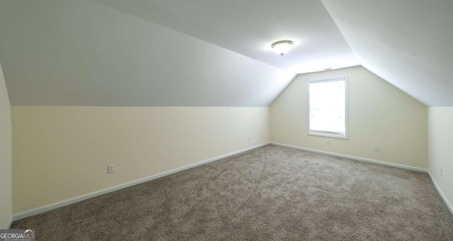 416 Clarion Dr, Carrollton, GA 30116 - bonus room featuring lofted ceiling, carpet, and baseboards