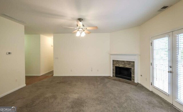 416 Clarion Dr, Carrollton, GA 30116 - unfurnished living room featuring carpet, ceiling fan, healthy amount of natural light, and a fireplace