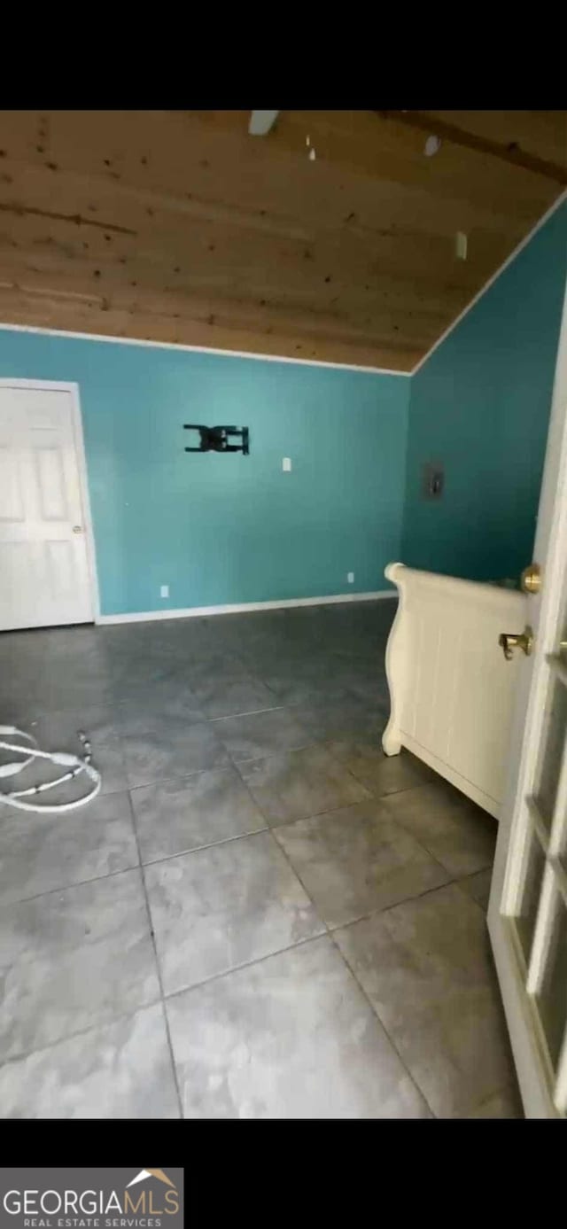 4922 Van Cise Ln, Albany, GA 31721 - interior space featuring lofted ceiling, baseboards, and tile patterned flooring