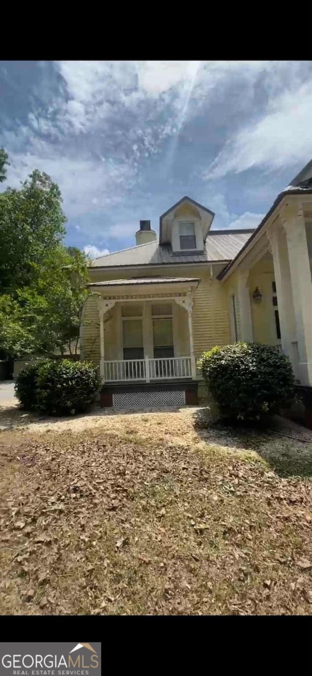 4922 Van Cise Ln, Albany, GA 31721 - property entrance with covered porch and a chimney