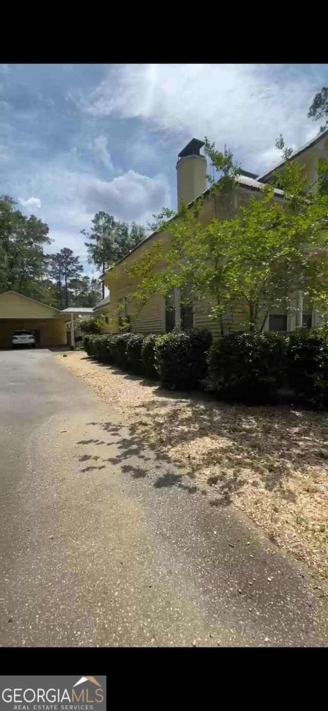 4922 Van Cise Ln, Albany, GA 31721 - view of property exterior with a chimney