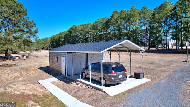 114 N Valhalla Dr, Cordele, GA 31015 - view of parking with a detached carport