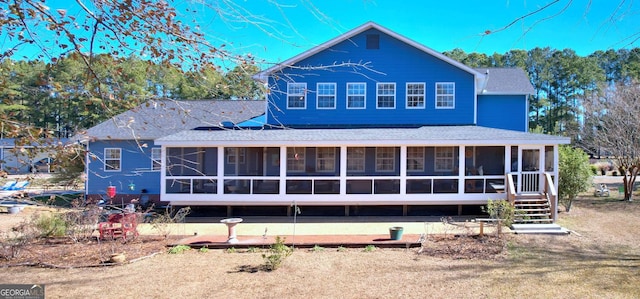 114 N Valhalla Dr, Cordele, GA 31015 - rear view of house featuring a sunroom and roof with shingles