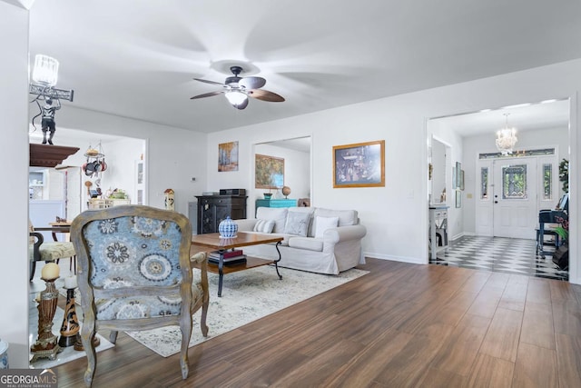 114 N Valhalla Dr, Cordele, GA 31015 - living room featuring wood finished floors, a ceiling fan, baseboards, and a chandelier