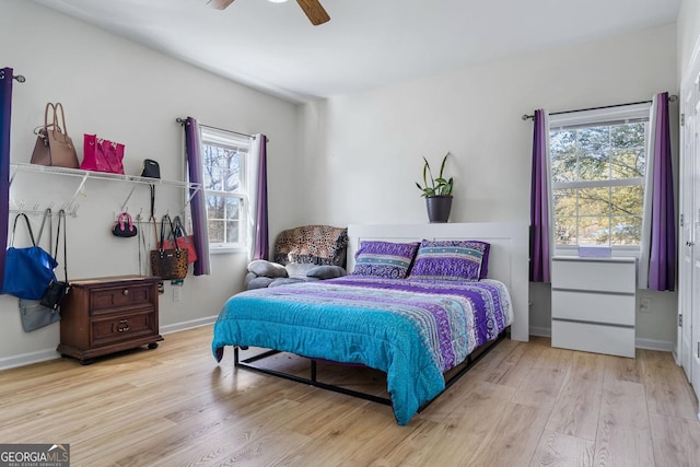 114 N Valhalla Dr, Cordele, GA 31015 - bedroom with wood finished floors, ceiling fan, and baseboards