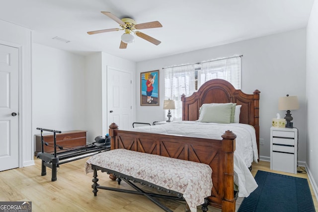 114 N Valhalla Dr, Cordele, GA 31015 - bedroom featuring light wood-style floors, a ceiling fan, and baseboards