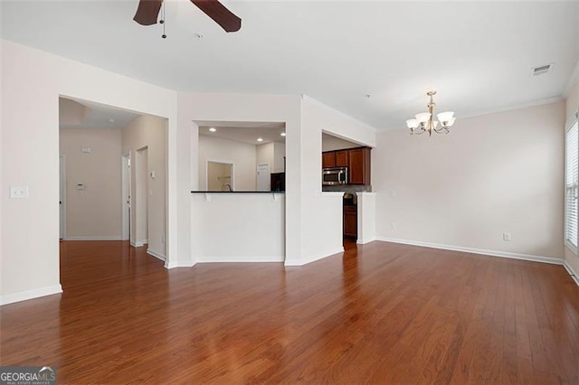 1957 Brightleaf Way Unit 59, Marietta, GA 30060 - unfurnished living room with a chandelier, a ceiling fan, dark wood-style floors, and baseboards